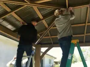 Fully installed Yardistry cedar gazebo with metal roof in customer garden