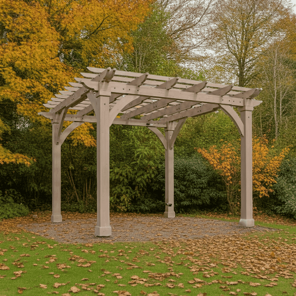 Yardistry Wooden Pergola 12ft x 12ft (3.7m x 3.7m) 3.7m x 3.7m Wooden Gazebo Premium Cedar Gazebos with Aluminium Roofs Wooden pergola with an open slatted roof supported by four sturdy posts, set on a gravel patch surrounded by grass and autumn trees with vibrant yellow, orange, and green foliage.