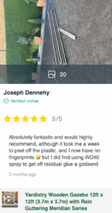 Yardistry gazebo components laid out in garden during assembly with customer review overlay