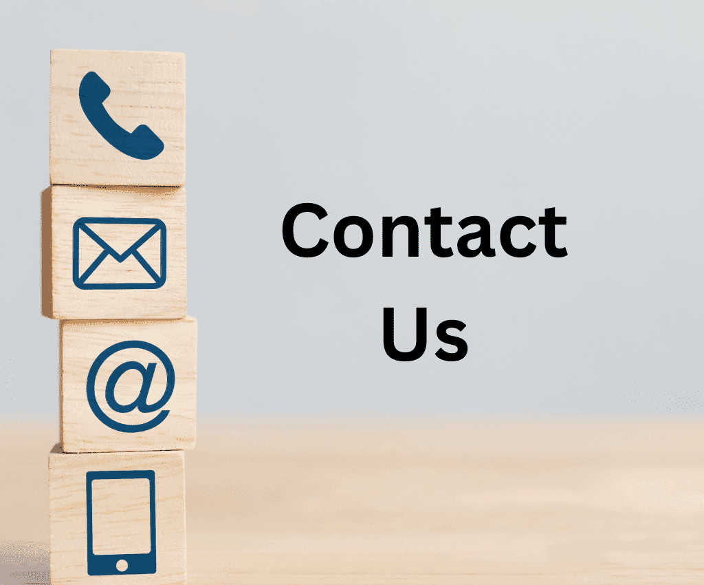 Four stacked wooden blocks with blue communication icons (phone, envelope, @ symbol, smartphone) beside bold black text reading “Contact Us” on a light wooden surface.