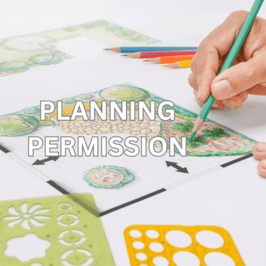Hand drawing a detailed UK garden design plan with colored pencils and stencils, highlighting planning permission considerations.
